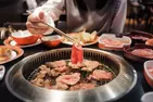 All You Can Eat BBQ & Sushi Extravaganza: Savory Meats, Rolls & More!