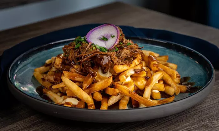 Indulge in a Cozy Dinner for Two or Four with Cocktails