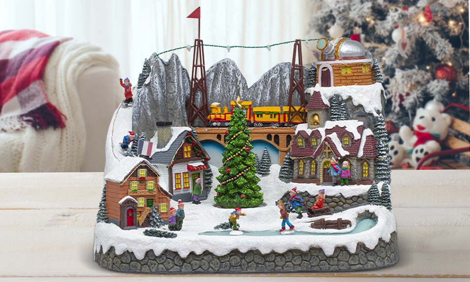 Adorno navideño "Aldea de Navidad" con luces de colores y melodía