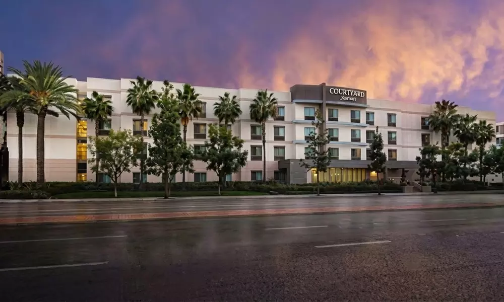 Courtyard-Style Hotel Retreat with Outdoor Pool & Bistro Dining