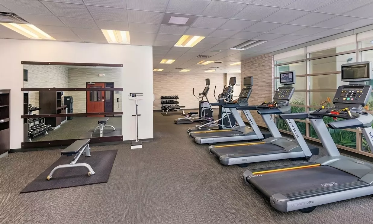 Courtyard-Style Hotel Retreat with Outdoor Pool & Bistro Dining