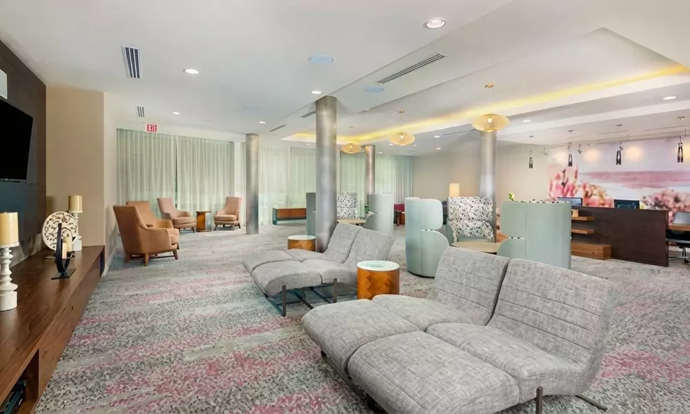 Courtyard-Style Hotel Retreat with Outdoor Pool & Bistro Dining