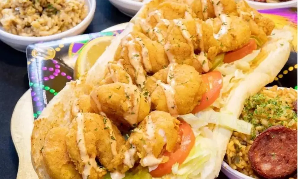Two Po'Boys, Meals for Two or Four With Beignets, and $50–$75 Credits