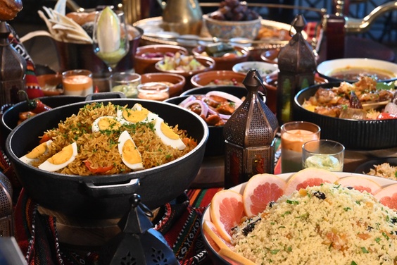 A lavish international Iftar buffet spread with a variety of dishes and drinks.