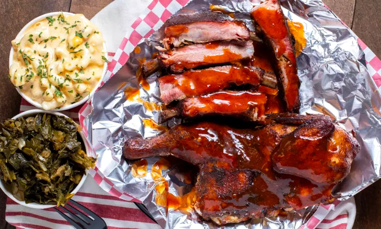 Authentic Slow-Smoked BBQ: Enjoy Dinner Entrees, Sides & Drinks or Credit Towards Cuisine (Up to 36% Off)