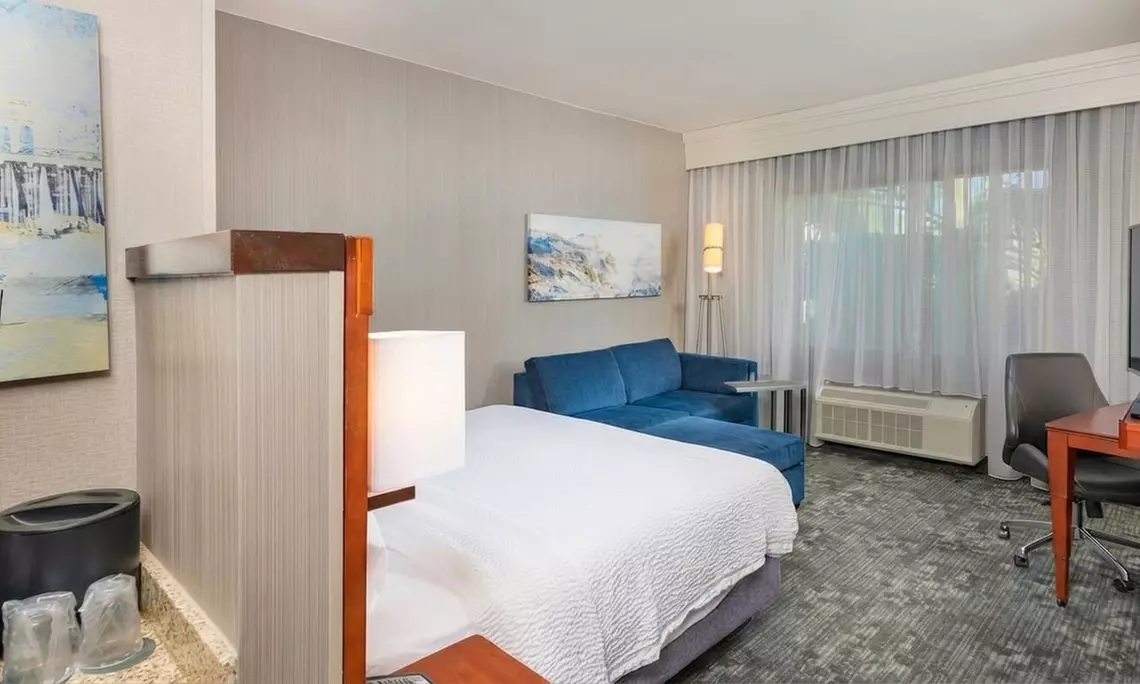 Courtyard-Style Hotel Retreat with Outdoor Pool & Bistro Dining