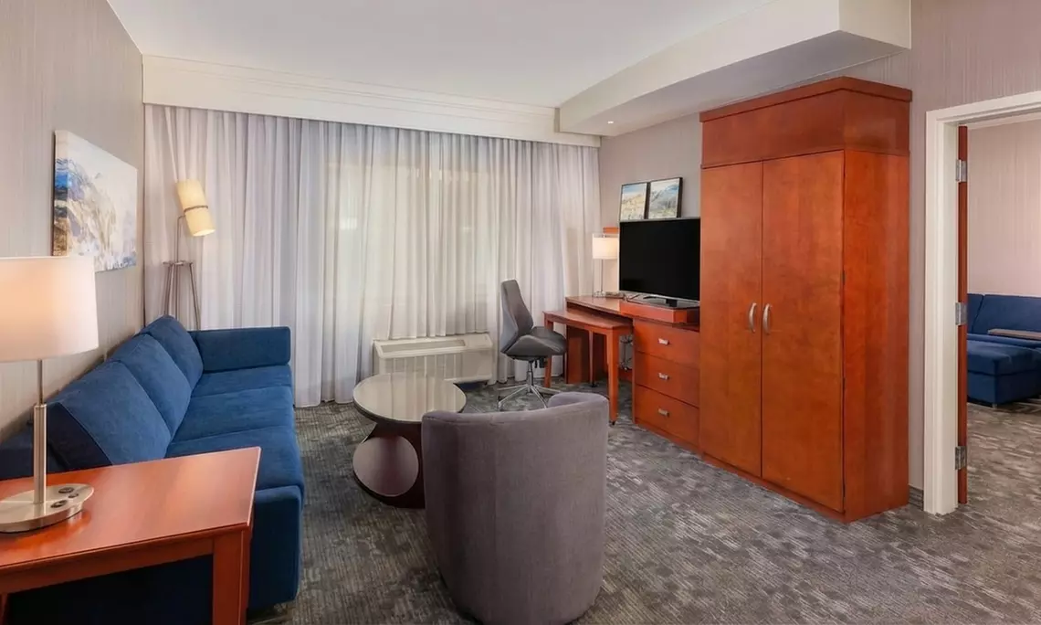 Courtyard-Style Hotel Retreat with Outdoor Pool & Bistro Dining