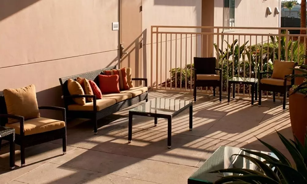 Courtyard-Style Hotel Retreat with Outdoor Pool & Bistro Dining