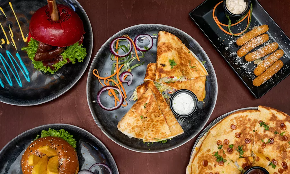 1 oder 2x Burger nach Wahl oder Traditional Chicken Wings inkl. Fries