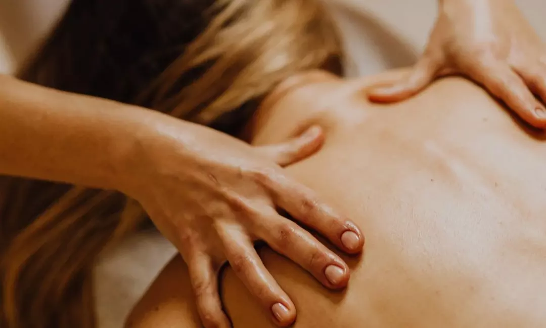 Experience a 60-Minute Thai Massage with Hot Stones or Essential Oils
