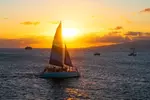 Board from Waikiki Beach for a scenic Sunset Sail on the Hāwea