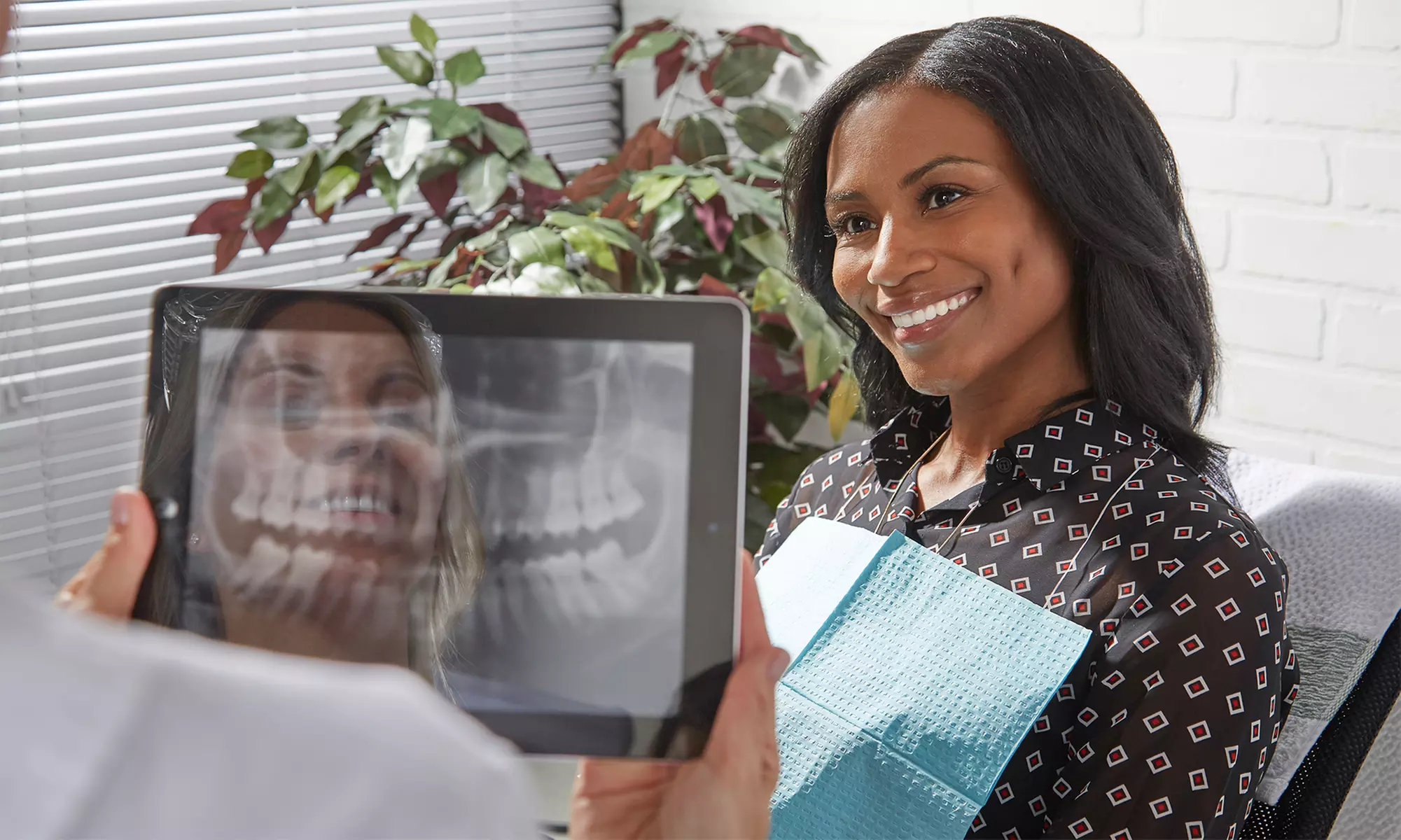 $33 for Dental Exam, X-Ray, & $1,500 Toward Implant or Fixed Bridge at Novel Smiles (Up to $1,800 Value)   - Primary Image