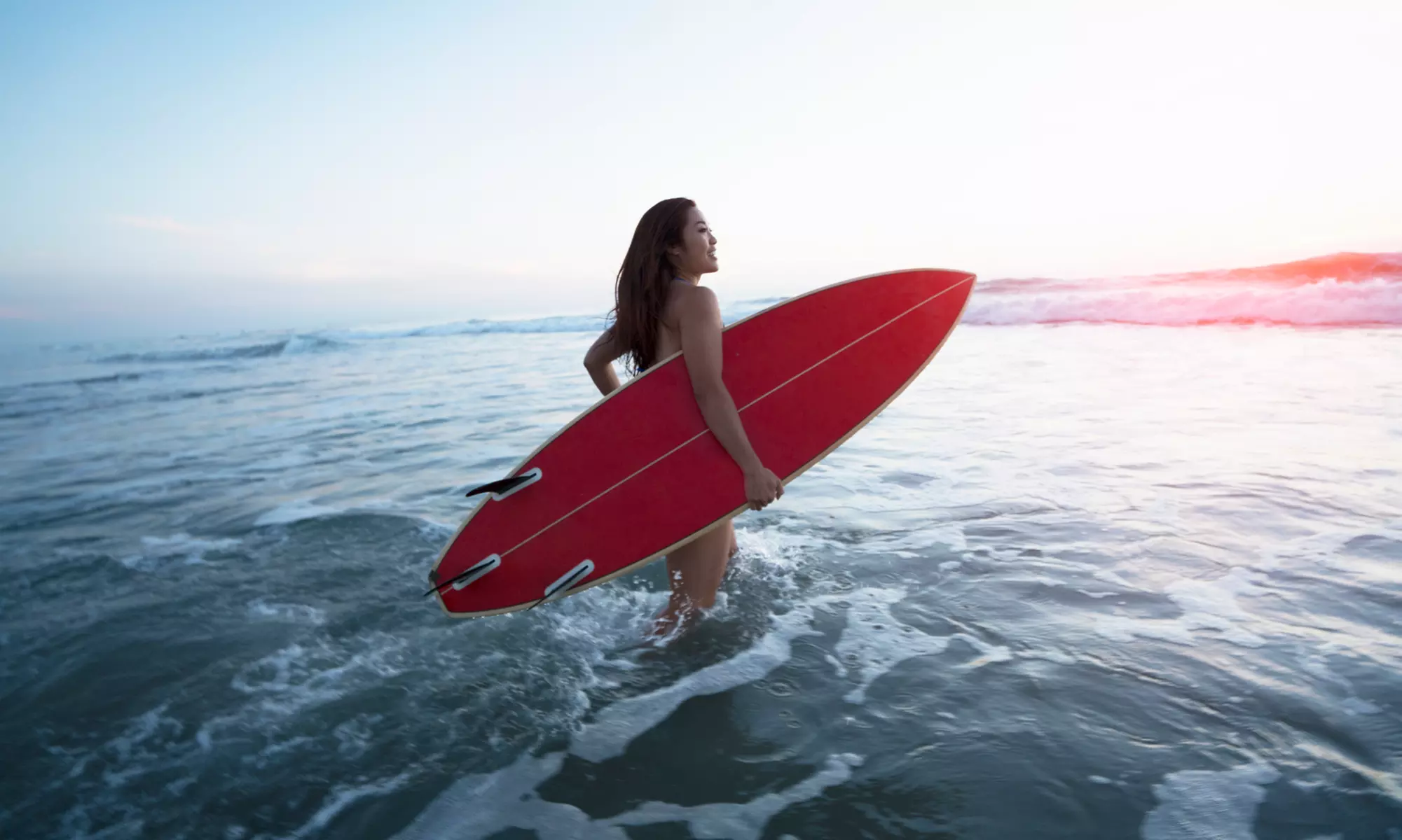 Experience Blue Bus Surf Lessons: Two-hour surfing lessons with board and wetsuit included, available for up to 19% off - Primary Image