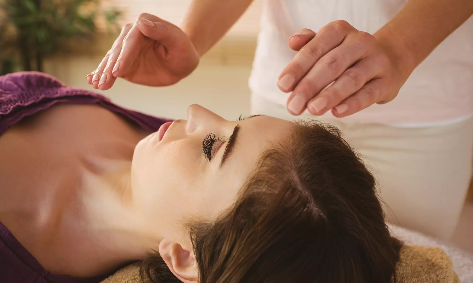 Experience up to 50% off a soothing Reiki session at Unique Vibes Botanica, offering 30 or 60-minute light therapy options. - Primary Image