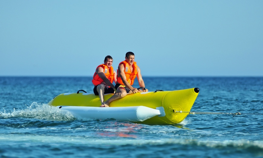 Image 1: Thrilling Rides: 30-Min inflatable Banana or Donut-shaped Boat Ride 