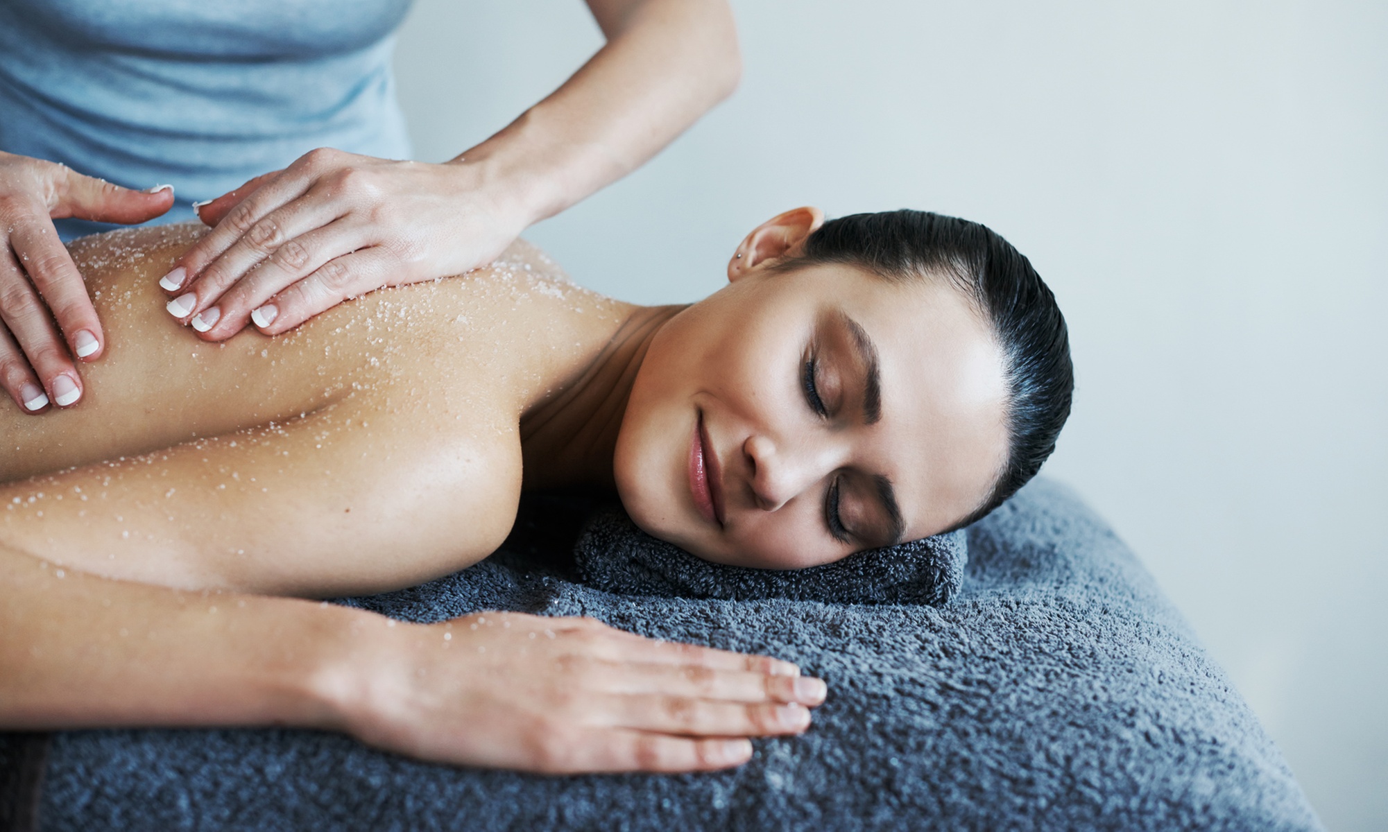 Unwind with Soothing Back Scrub or Mani-Pedi Service!