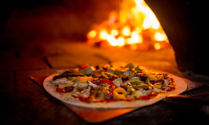 Image 1: Enjoy Wood-Fired Pizza and a Mediterranean Feast (Up to 40% Off) 