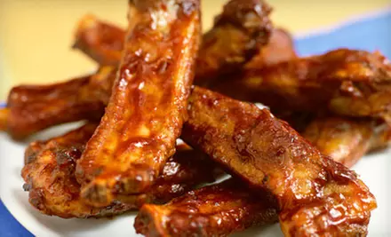 $10 for $20 Worth of Barbecue Fare or Family Meal with Main Course, Six Sides, and Rolls at Honey Bear's BBQ - Primary Image