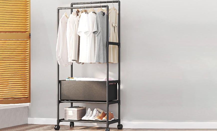 Image 1: Metal Clothes Rack with Double Rods Mobile on Wheels