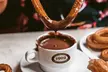 2 tazas de chocolate a elegir con churros en Chocolatería Los artesanos 1902 (hasta 22% de descuento) - Second Medium