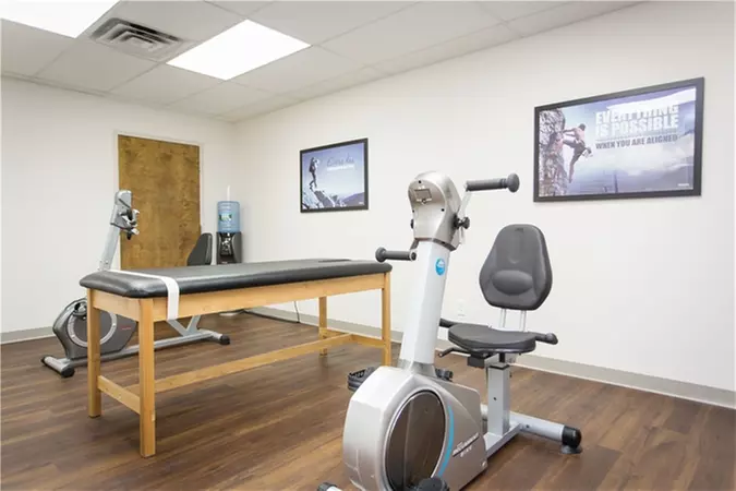 Exam with One Adjustment, Trigger-Point Therapy, and Exercises at Everest Chiropractic (Up to 86% Off)