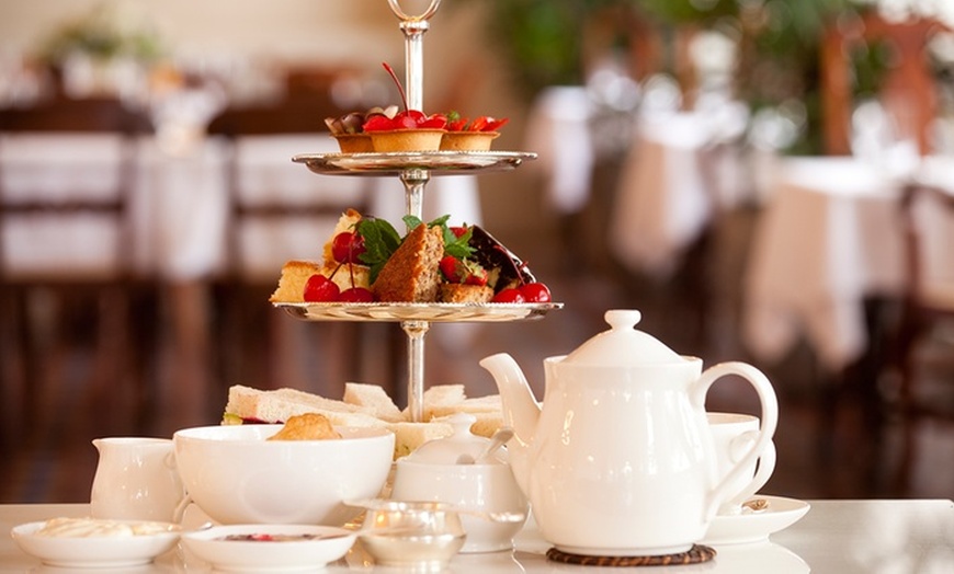 Image 1: Relaxing Afternoon Tea with a Glass of Buck's Fizz in Historic Stables