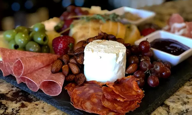 Dining Experience with Take-Home Bottle of Wine and Glasses for Two or Four at Cave Cafe (Up to 44% Off) - Primary Image