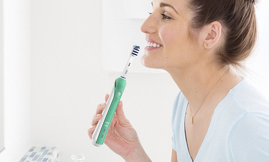 Image 2: Oral-B Electric Toothbrush