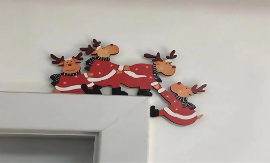 Image 7: One- or Six-Pack of Festive Wooden Door Frame Decorations