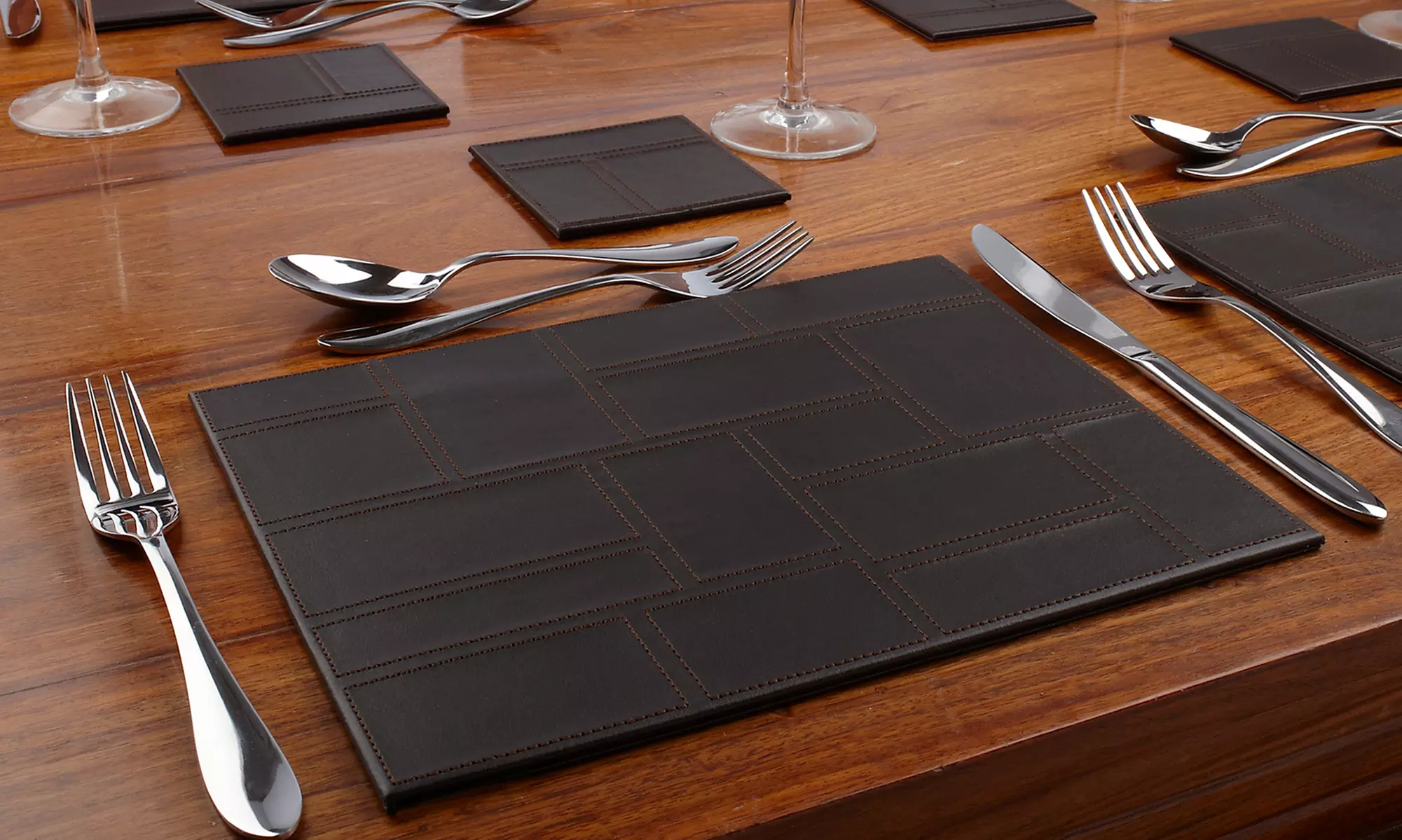 Set of Four Inspire Faux Leather Placemats or Coasters in Black or Brown - Primary Image