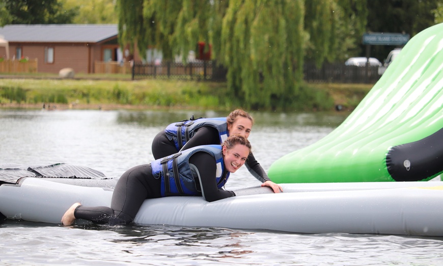 Image 8: Aqua Park Entrance with Wetsuit