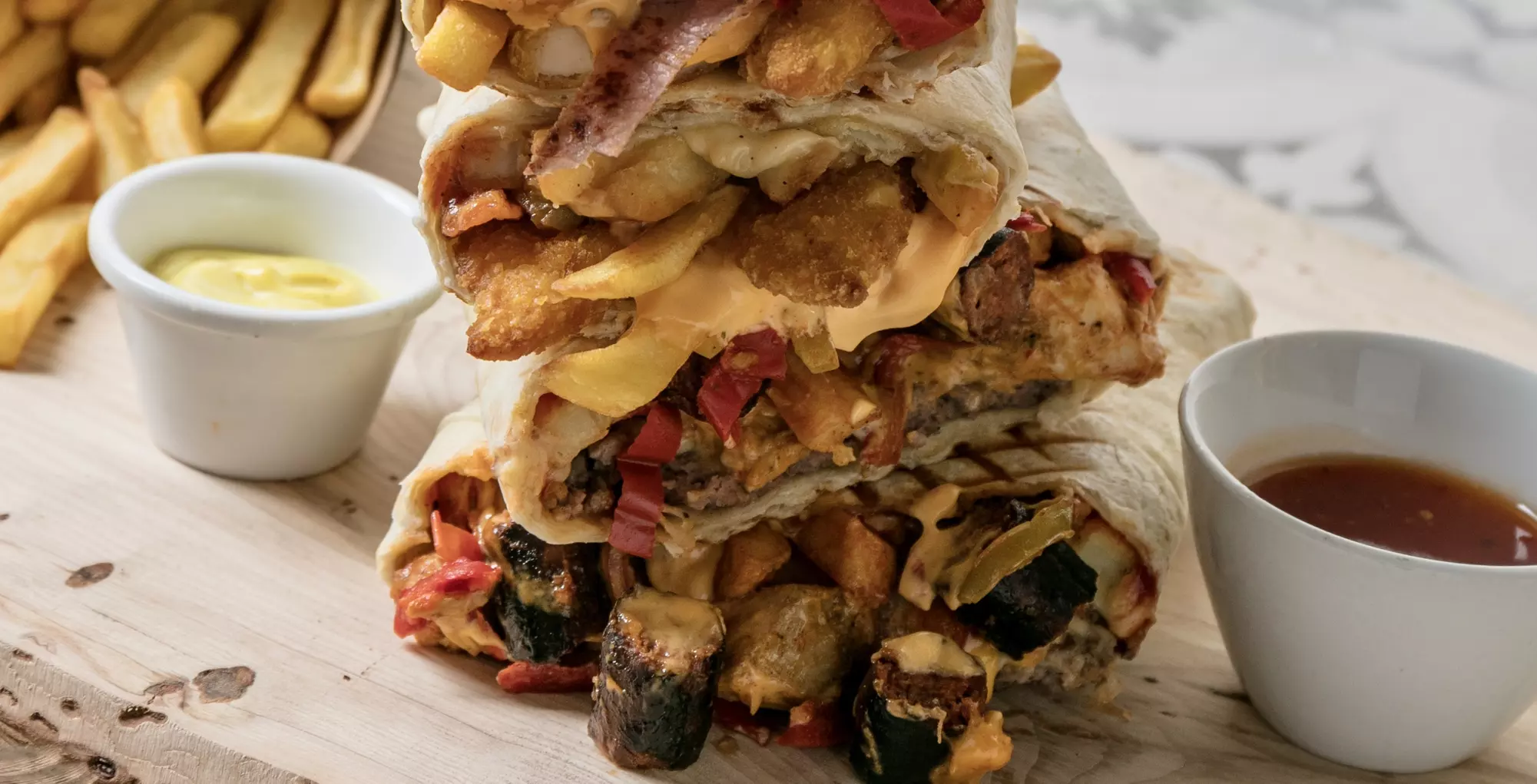 2 french tacos avec viande, sauce(s) au choix, frites et sauce fromagère à 9,90 € au restaurant Original's Tacos© - Second Medium