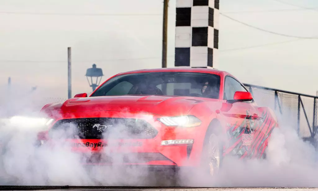 Experience Tampa Bay Race Rentals' thrilling Mustang GT ride along or race package with up to 30% off - Second Medium