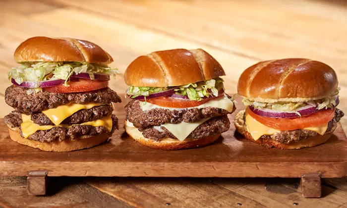 Wings, Burgers, Drinks, and More at Hurricane BTW (Up to 40% Off). Two Options Available.  - Primary Image
