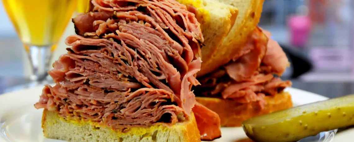 One or Two 7-Ounce Deli Sandwiches with One or Two Sides of Fries at Corned Beef House (Up to 37% Off) - Primary Image