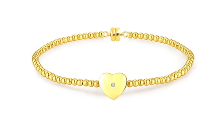 Bracelet plaqué or avec pendentif cœur orné d'un véritable diamant présenté dans une boîte à bijoux