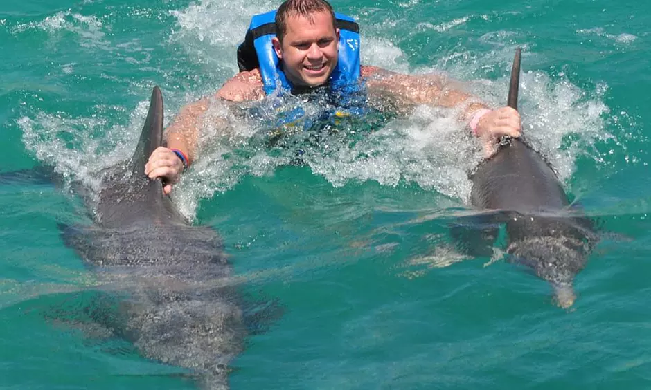 Discover Isla Muj: Royal Swim & Dolphin Encounter Await!