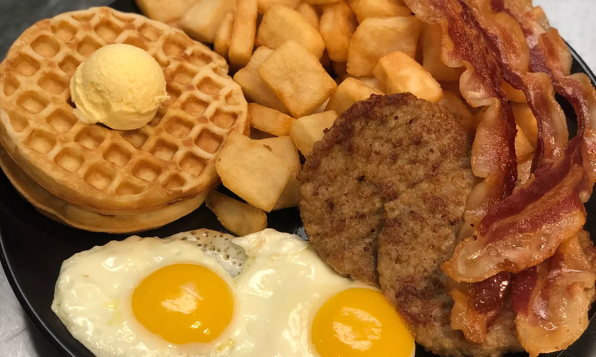 $10 for $20 at Waffles R Wild Bar & Grill (Up to 50% Off) - Second Medium