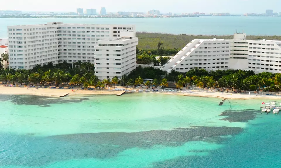 All-Inclusive Grand Oasis Palm Vacation with Airfare. Includes Taxes and Fees. Price/person Based on Double Occupancy. - Primary Image