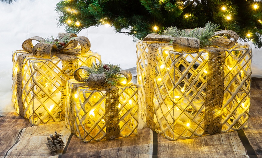 Image 1: Set of Three Illuminated LED Gold Christmas Boxes