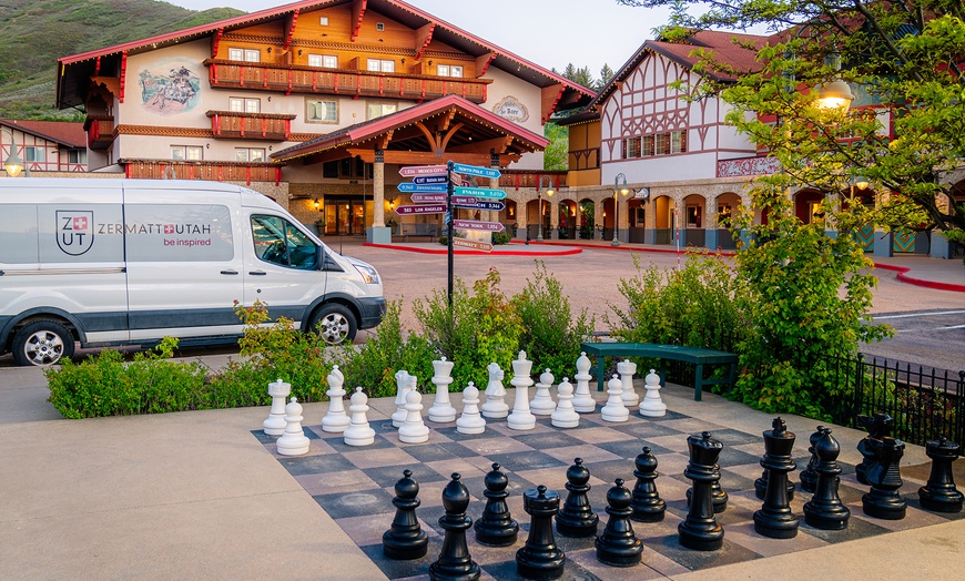 Image 9: Cozy alpine rooms, heated pool, and mountain views