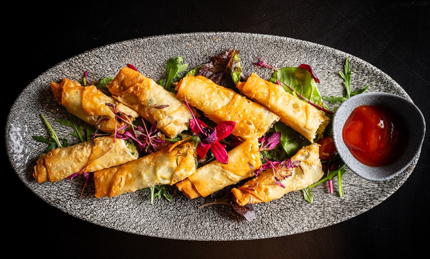 Image 4: Mezzes with Bread, Olives, and Sauces at The Nazar Lounge