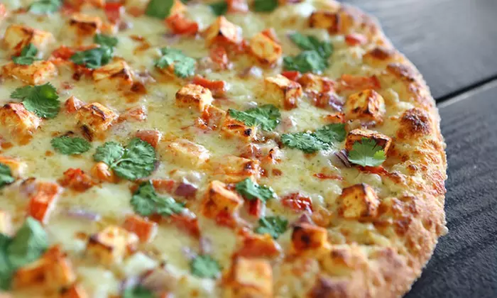 Indian-Inspired Pizzeria Fare for Takeout at Namaste Pizza (Up to 38% Off). Two Options Available. - Primary Image