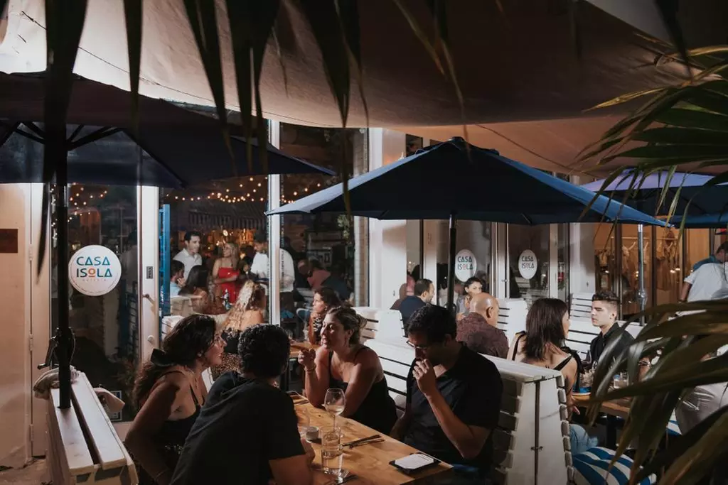 $50 or $100 Toward Food & Drink or Pasta Dinner with Wine for Two or Four at Casa Isola Osteria (Up to 32% Off) - Second Medium
