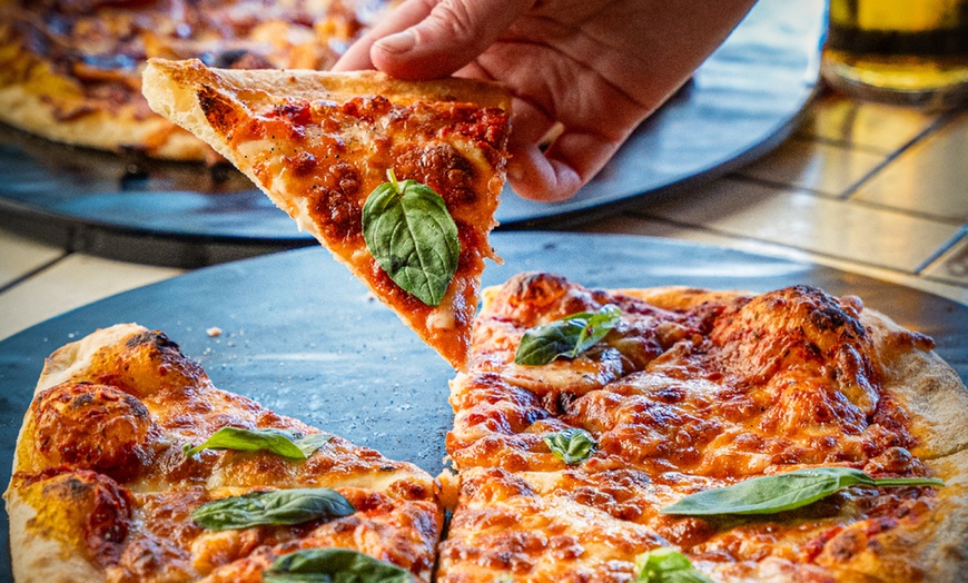 Image 6: Satisfy Your Cravings: Choice of Any Two / Four Pizzas and Drinks