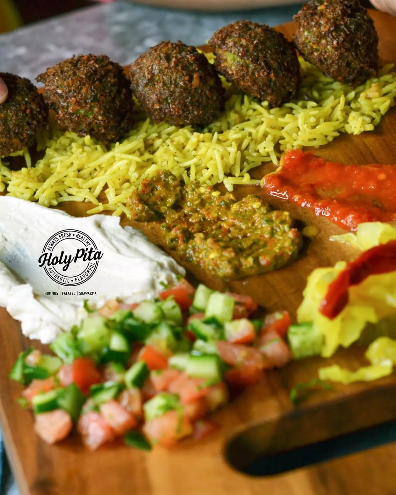 Authentic Mediterranean Delights Await: $30 or $60 to Use at Holy Pita