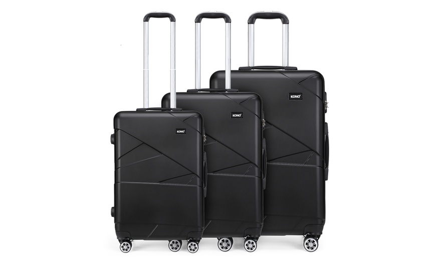 Image 1: One or Three Kono Hard-Shell Black Suitcases