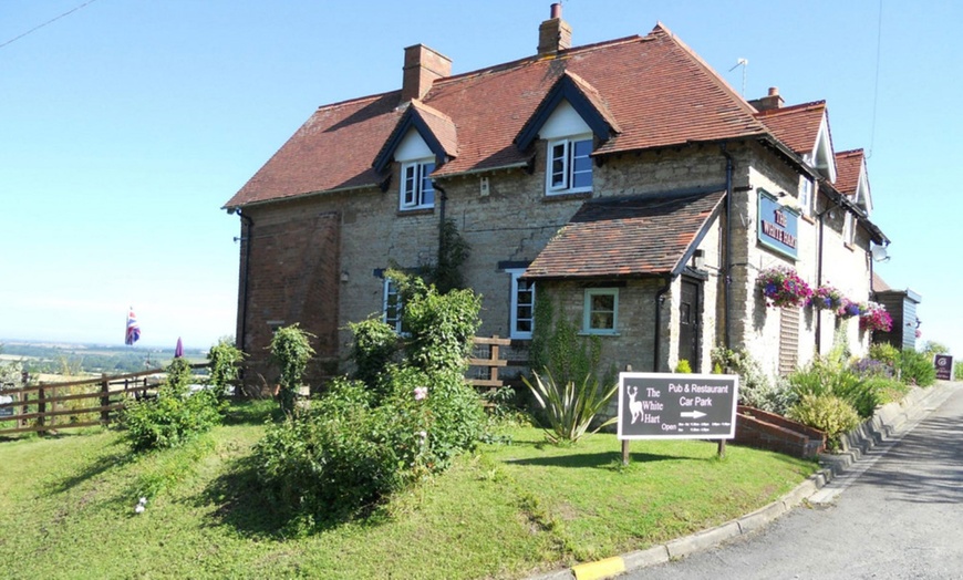 Image 5: Indulge in a Delicious Meal at Our Historic Village Pub