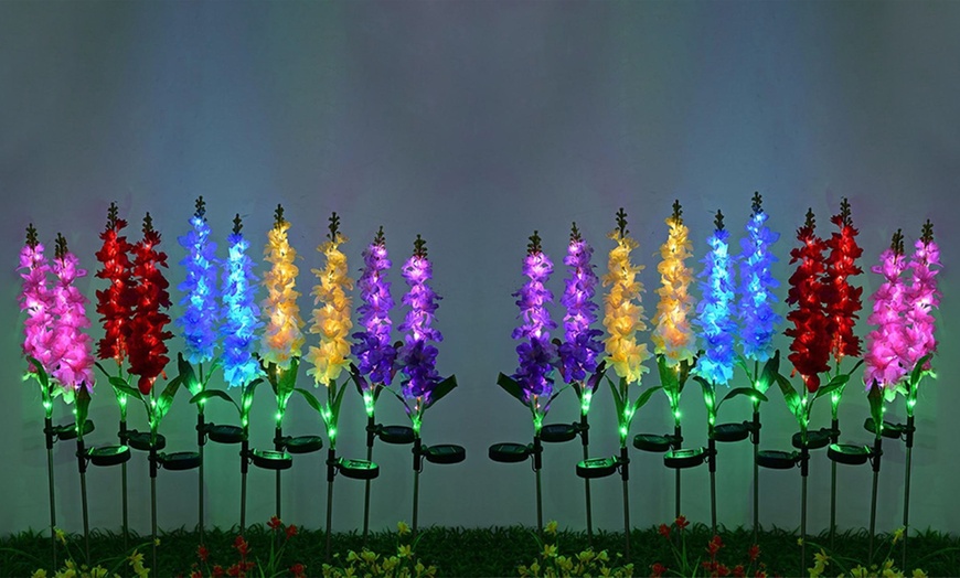 Image 1: One, Two or Four Solar Artificial Violets Flowers Lights