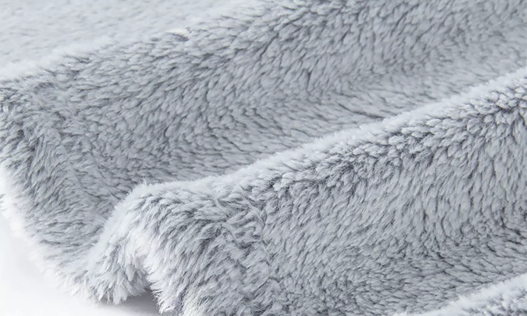 Kuscheldecke mit leuchtendem Stern- und Mond-Muster